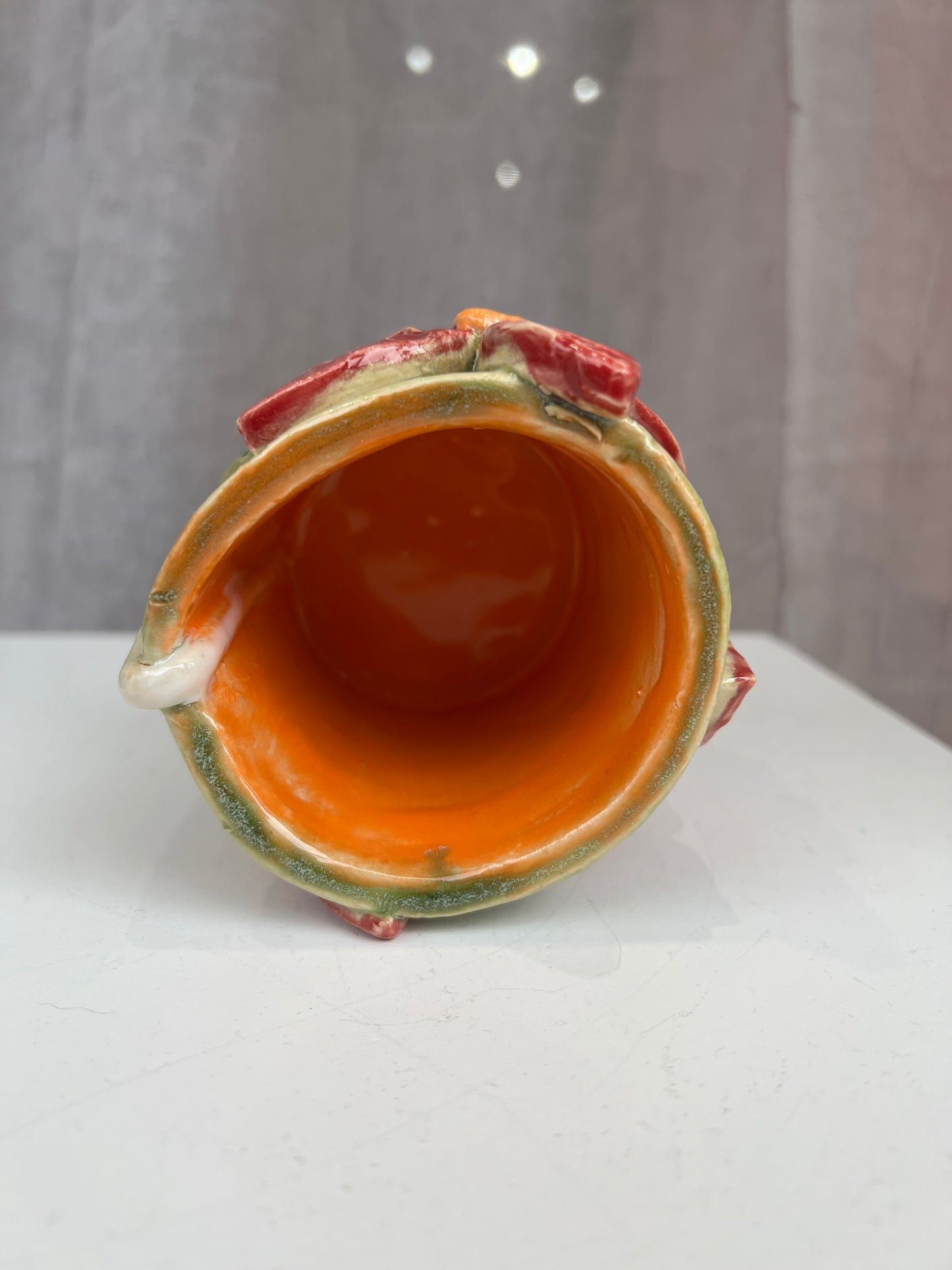 Green and red flower handle-less mug
