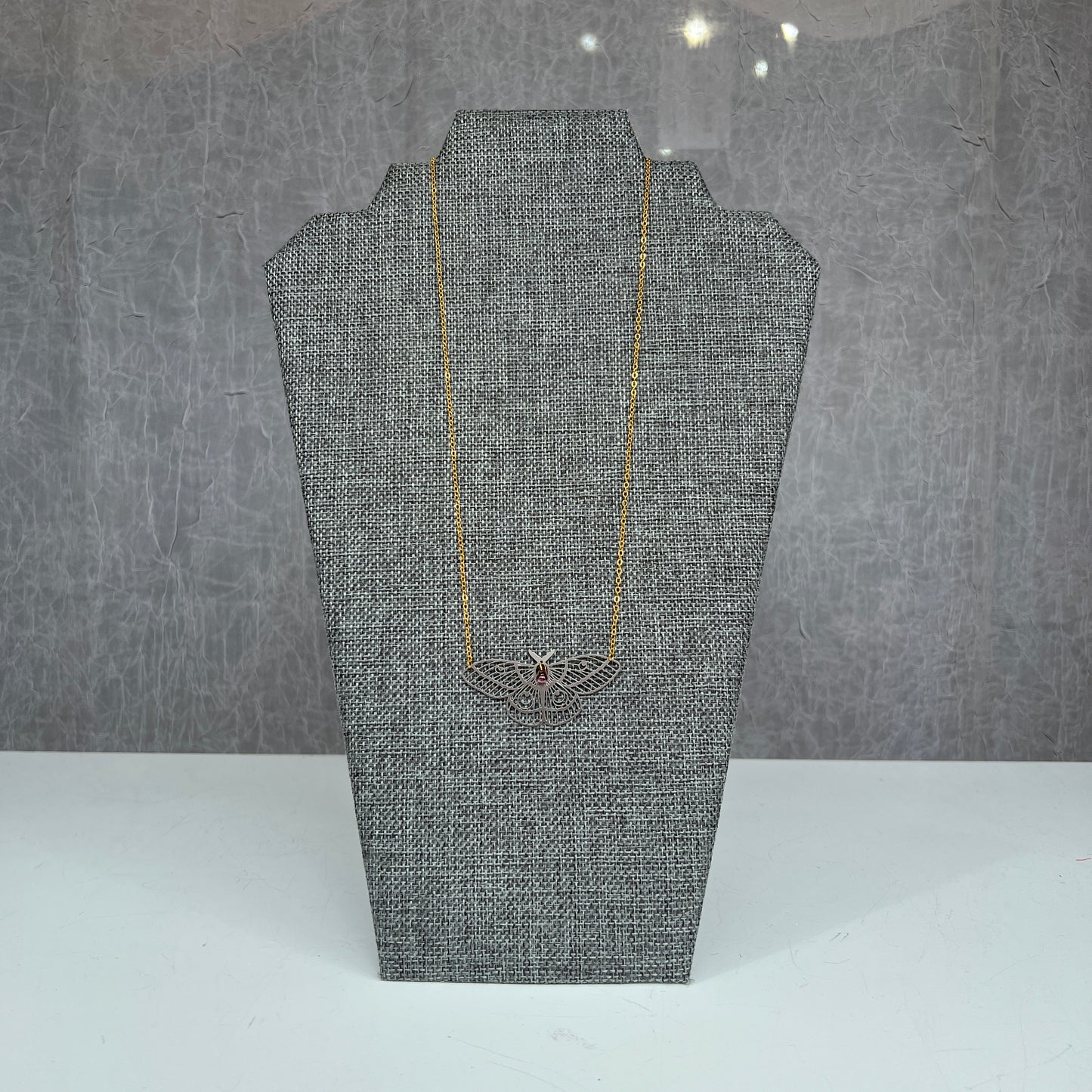 Island of Small Things laser cut moth necklace
